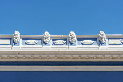 Low angle view of building against blue sky