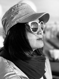 Close-up portrait of young woman wearing sunglasses