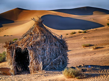 Scenic view of arid landscape against sky