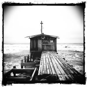 Pier on sea against sky