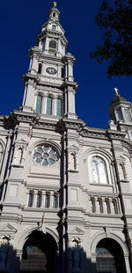 Low angle view of building against blue sky