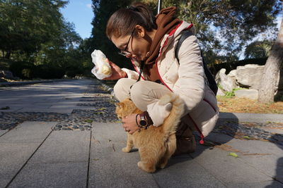 Man with dog on footpath