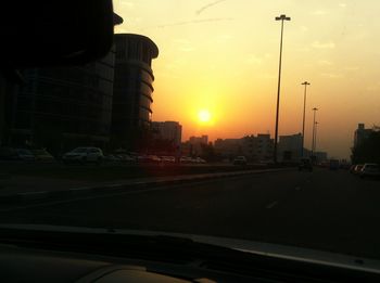 Traffic on road during sunset