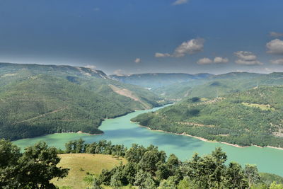 Scenic view of landscape and mountains against sky