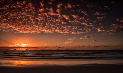 Scenic view of sea against sky at sunset