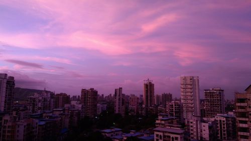 High angle view of buildings against sky during sunset