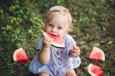 Portrait of cute boy eating food