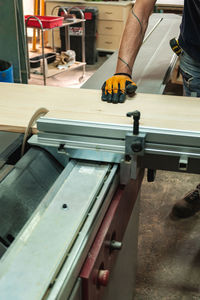 Man working on metal grate