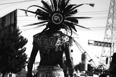 Rear view of woman with palm tree