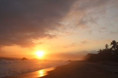 Scenic view of landscape against sky during sunset