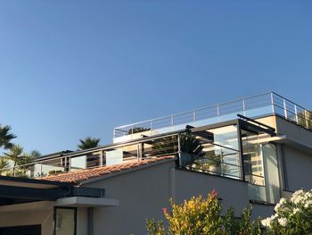 Low angle view of building against clear blue sky