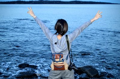 Rear view of woman at beach