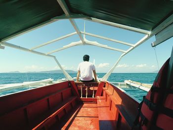 Rear view of man looking at sea