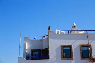 Low angle view of building against clear blue sky
