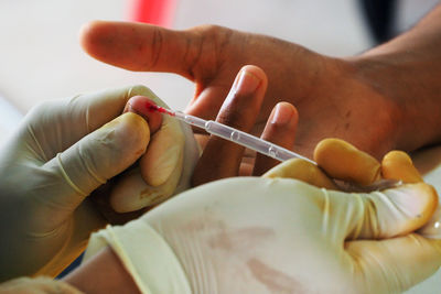 Close-up of woman hand holding cigarette