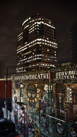 Low angle view of illuminated building at night