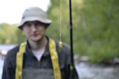 Portrait of man holding fishing rod
