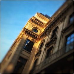 Low angle view of building against blue sky