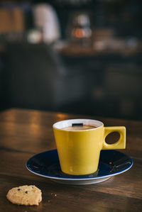 Close-up of coffee cup on table