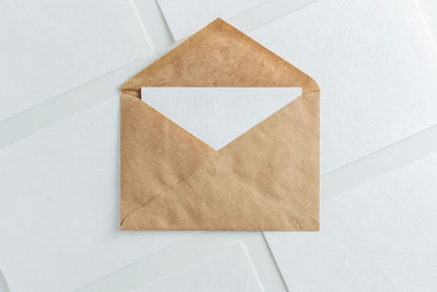 High angle view of paper on white wall