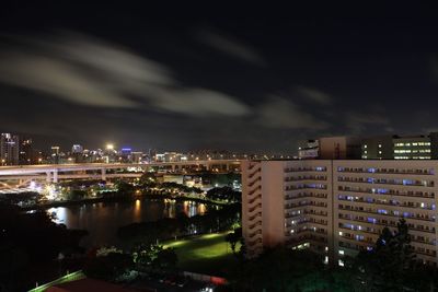High angle view of illuminated buildings in city at night