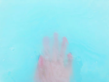 Close-up of woman swimming in pool