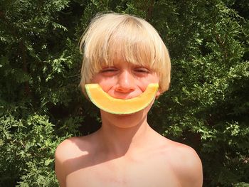 Close-up portrait of shirtless boy