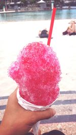 Close-up of hand holding ice cream