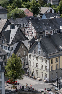 People on street amidst buildings in town