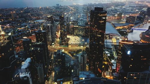 High angle view of illuminated city buildings at night