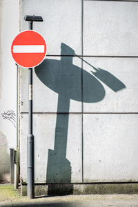 High angle view of road sign on field