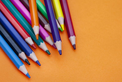 Colored pencils on bright colored background