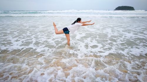 Rear view of woman on beach