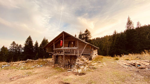 Built structure on landscape against sky