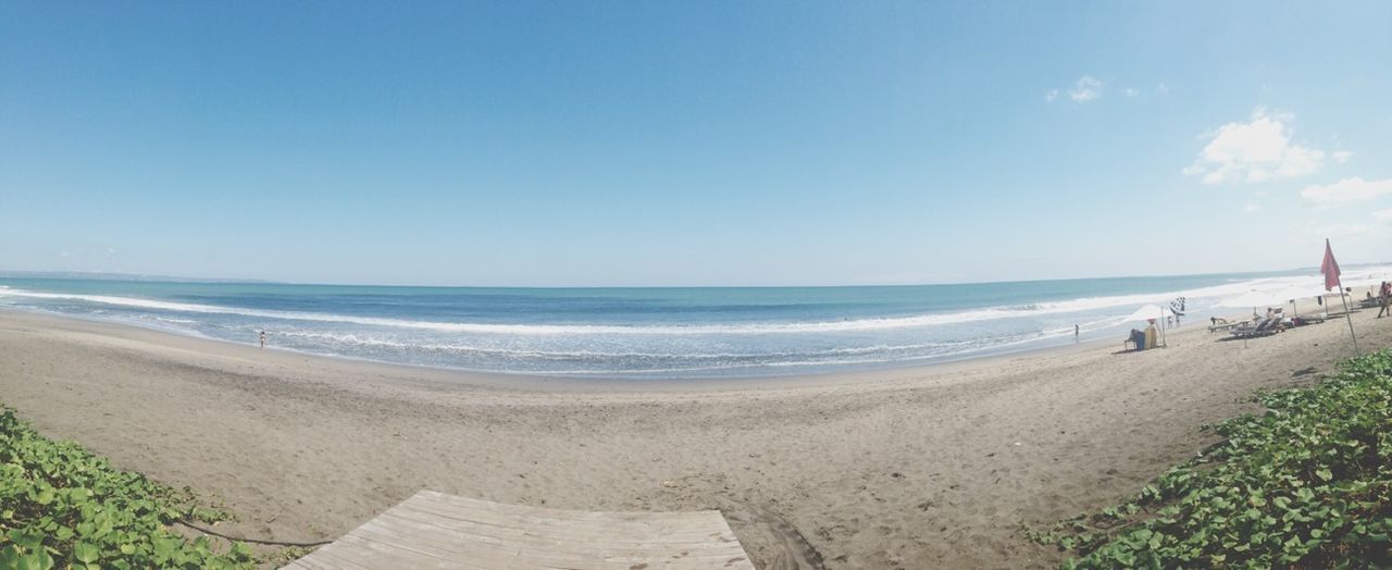 sea, beach, horizon over water, water, sand, shore, scenics, tranquil scene, tranquility, beauty in nature, sky, nature, incidental people, wave, idyllic, coastline, vacations, blue, clear sky, day