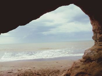 Scenic view of sea against cloudy sky