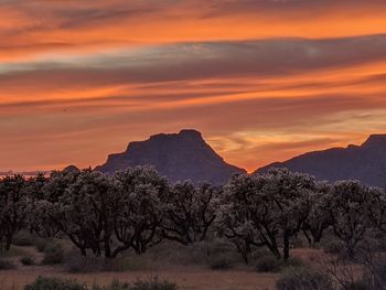 Scenic view of mountains against sky during sunset