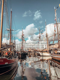 Boats moored at harbor