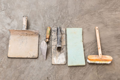 High angle view of objects on table against wall