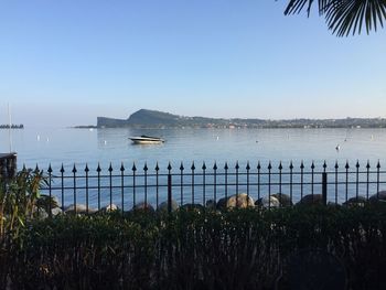 Scenic view of bay against clear sky