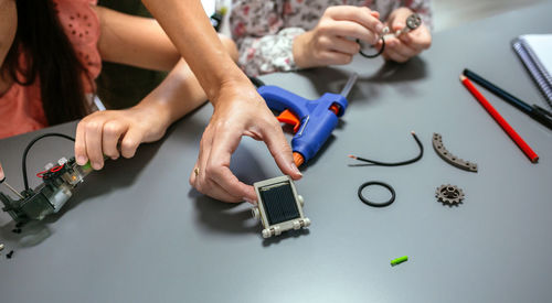 Midsection of woman working on table