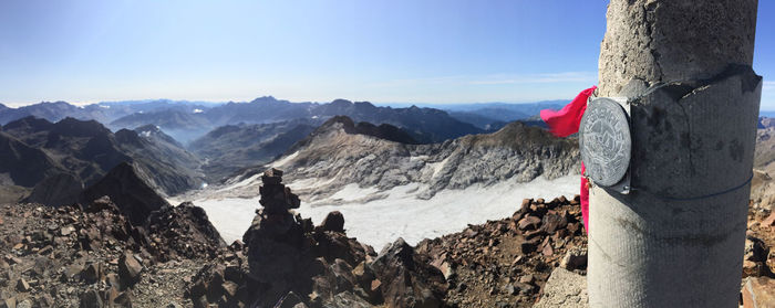 Panoramic view of mountains against blue sky