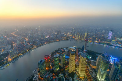 High angle view of illuminated buildings in city