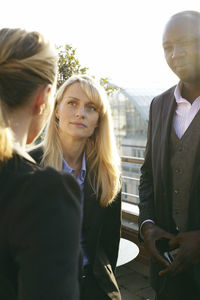 Professionals talking on terrace