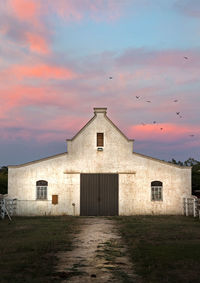 Building against sky during sunset