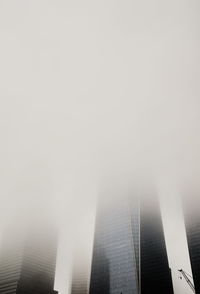 Low angle view of buildings against sky in city