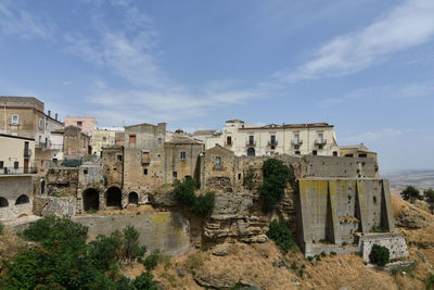 A narrow street among the old houses of irsina in basilicata, region in southern italy.