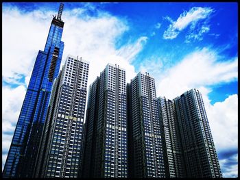 Low angle view of modern buildings against sky