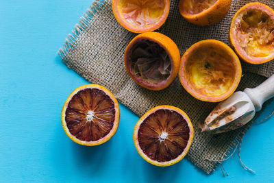 High angle view of oranges against blue background