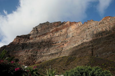 Low angle view of rock formations against sky